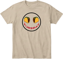 Khaki t-shirt with a graphic of tacos for eyes and 'Tuesday' text smile.