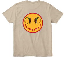  Back view khaki Taco Tuesday t-shirt with large smiley face design featuring tacos and the word 'Tuesday' smile with red trim.